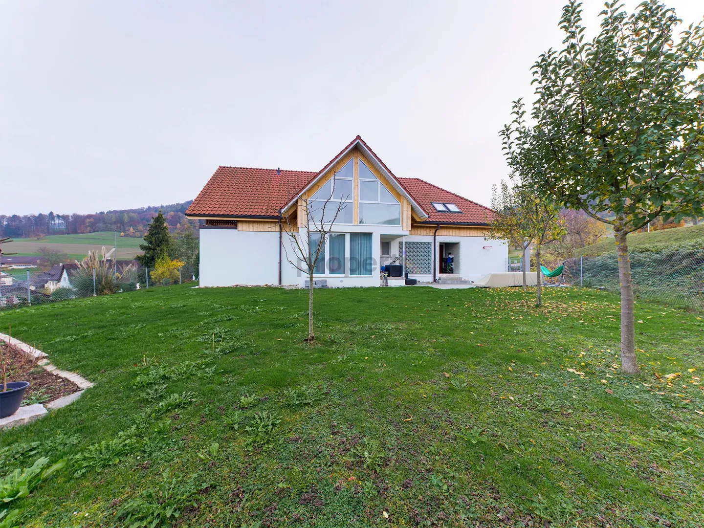 Light-Filled Dream Home in Weiach: Stylish 3.5-Room Attic Apartment with High Ceilings and Great Views - Photo 1 of 13