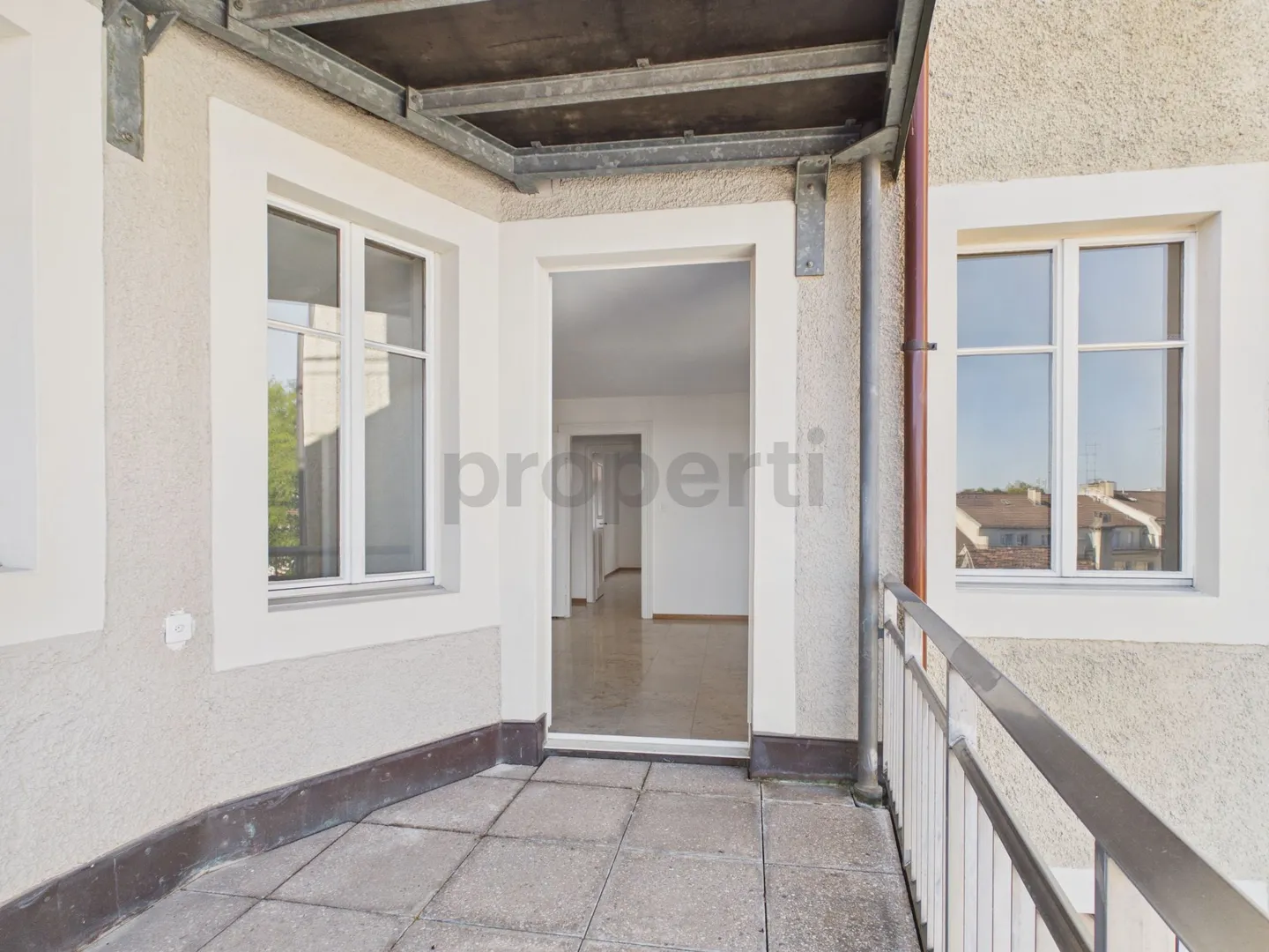 Charming Living with Balcony and Historic Flair - Photo 9 of 13