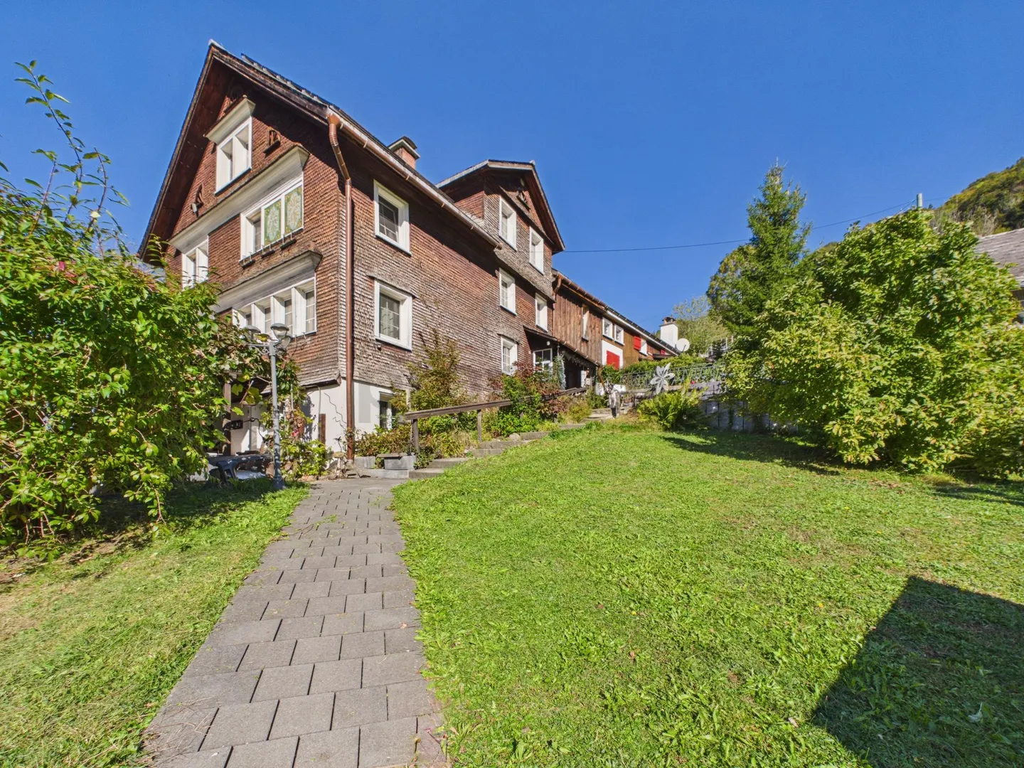 Historic Single-Family House with Plenty of Space and Development Potential in Ebnat-Kappel, SG - Photo 1 of 12