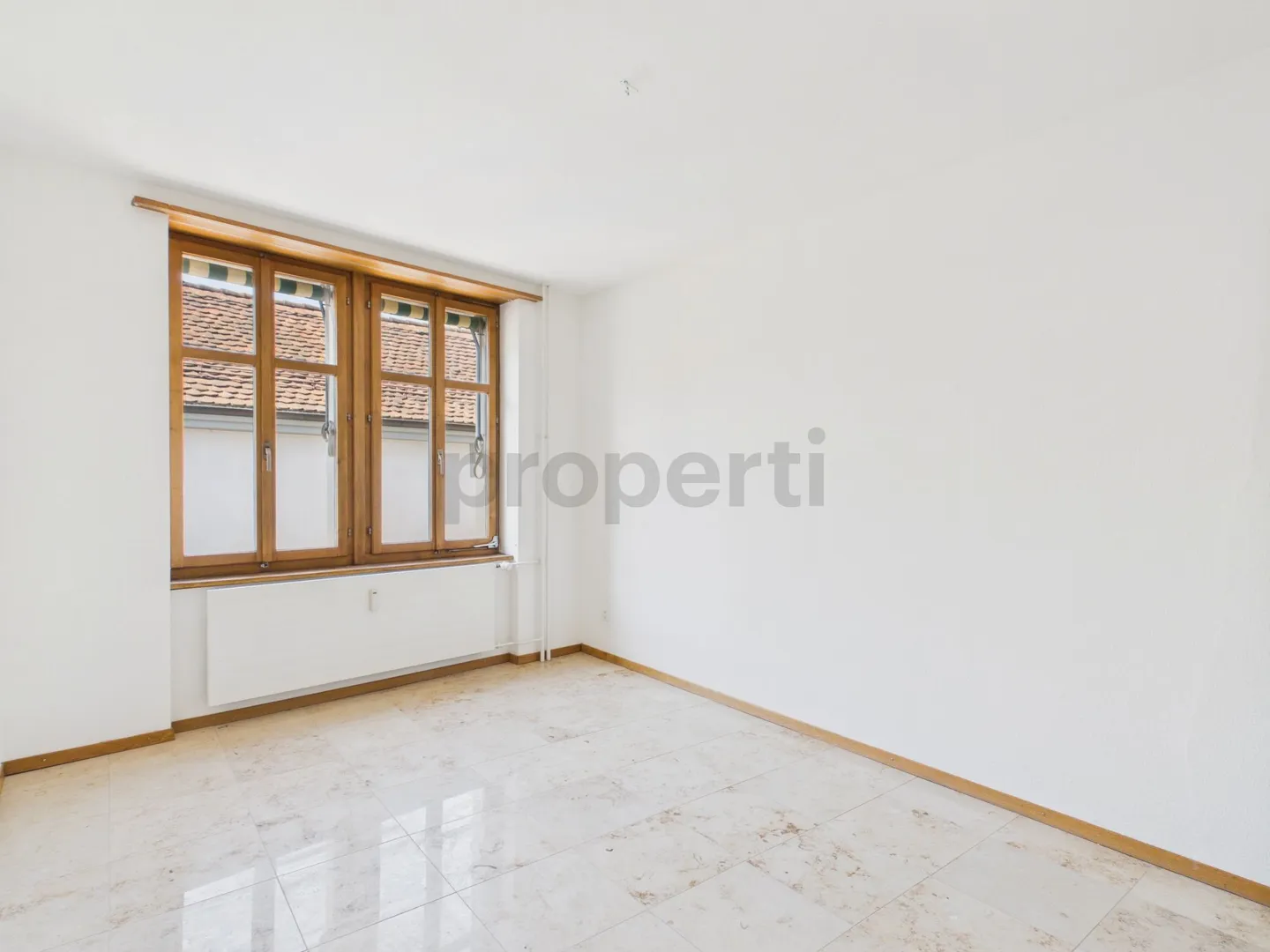 Charming Living with Balcony and Historic Flair - Photo 6 of 13