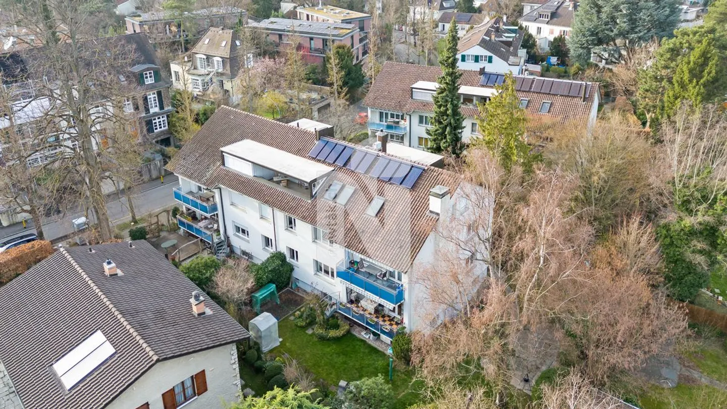 Family-friendly garden apartment with balcony, private garden, garage box, and additional hobby room in the best location on Bruderholz - Photo 1 of 12