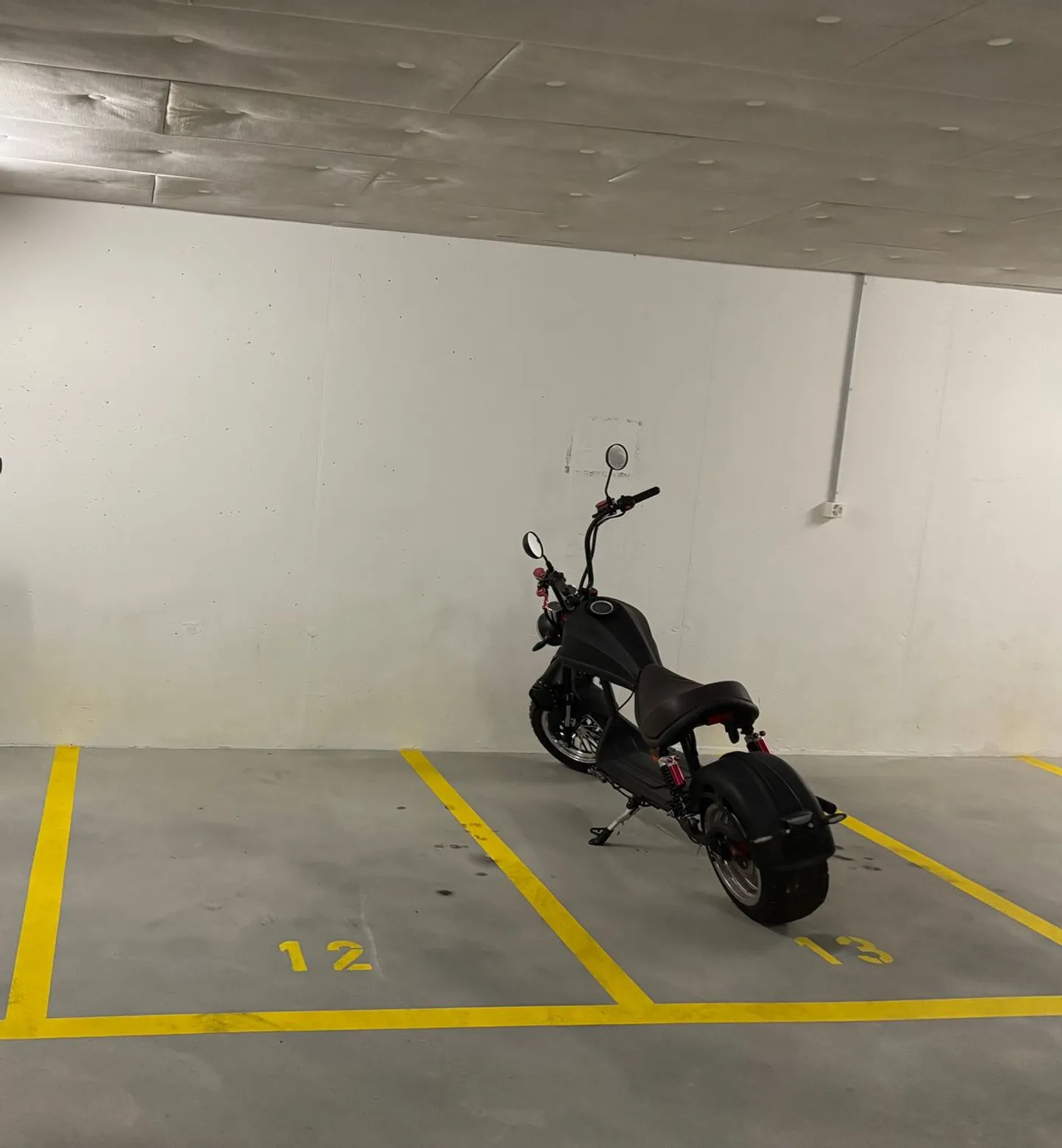Motorcycle parking in underground garage - Photo 1 of 2