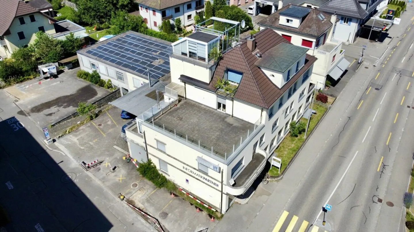 Multi-family house with commercial share and PV system in the core zone - Photo 9 of 13