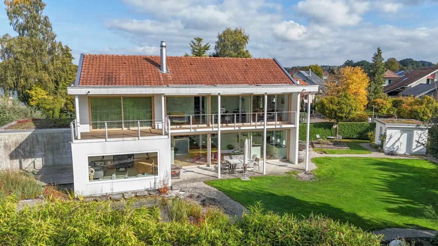 Timeless Architecture with Style - Spacious Single-Family Home with Natural Swimming Pond - Photo 1 of 13