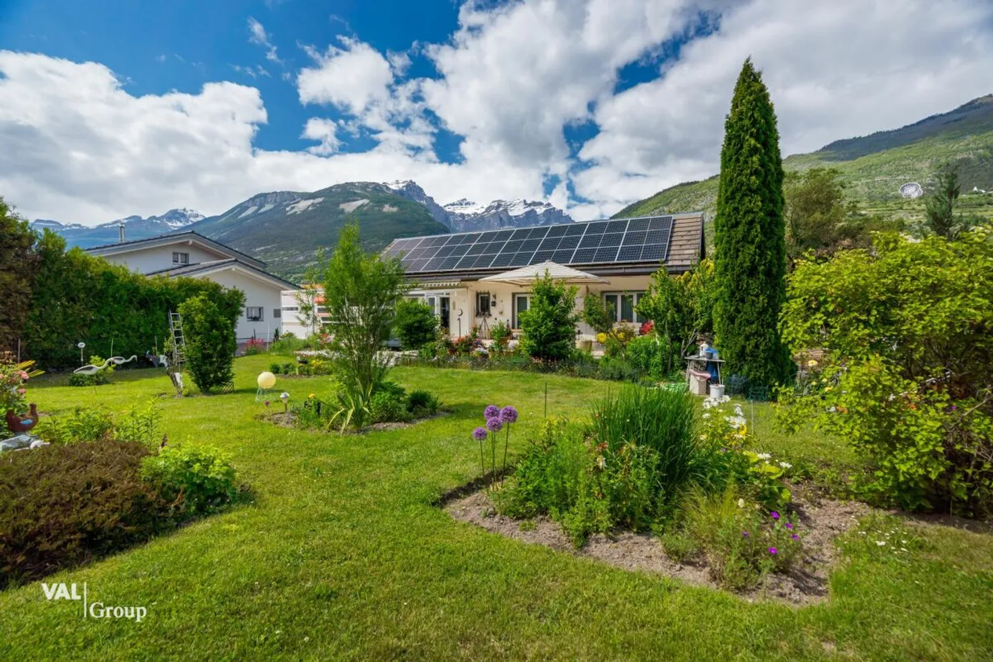 Une maison pour se sentir bien - avec parcelle à bâtir, véranda et espace extérieur ensoleillé - Photo 1 sur 13