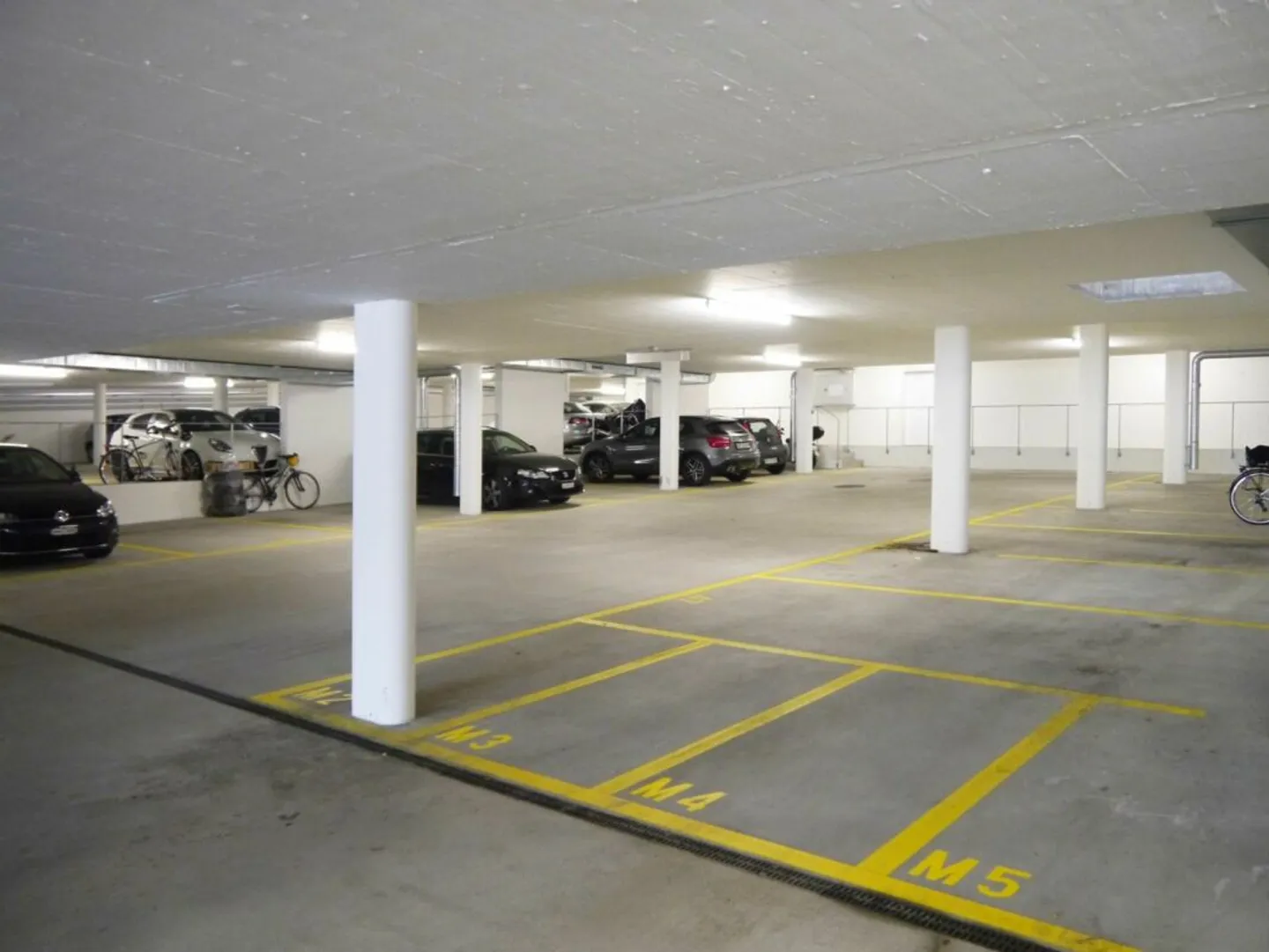 Parking spaces with and without E-charging station in bright underground garage in Abtwil for rent - Photo 3 of 3