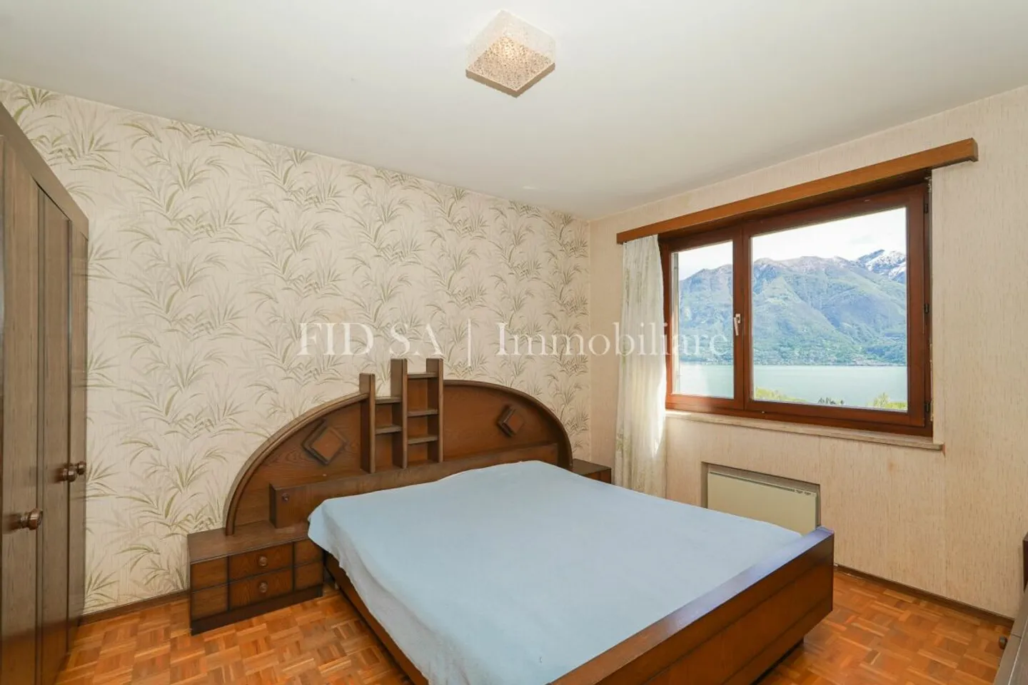 MINUSIO - Maison bifamiliale spacieuse avec un grand potentiel et une vue magnifique - Photo 9 sur 12