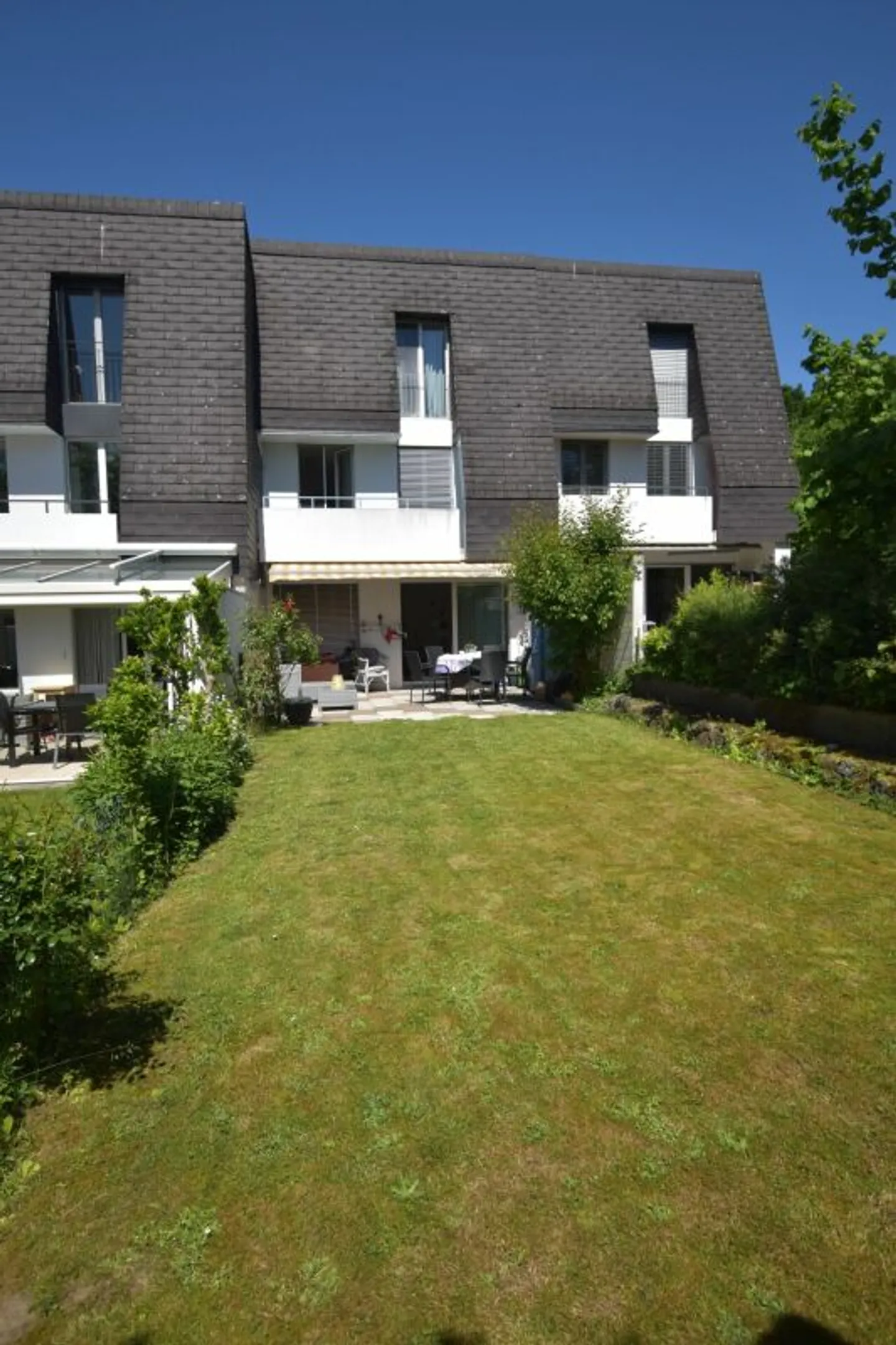 Modern Row House with Community Pool - Photo 2 of 13