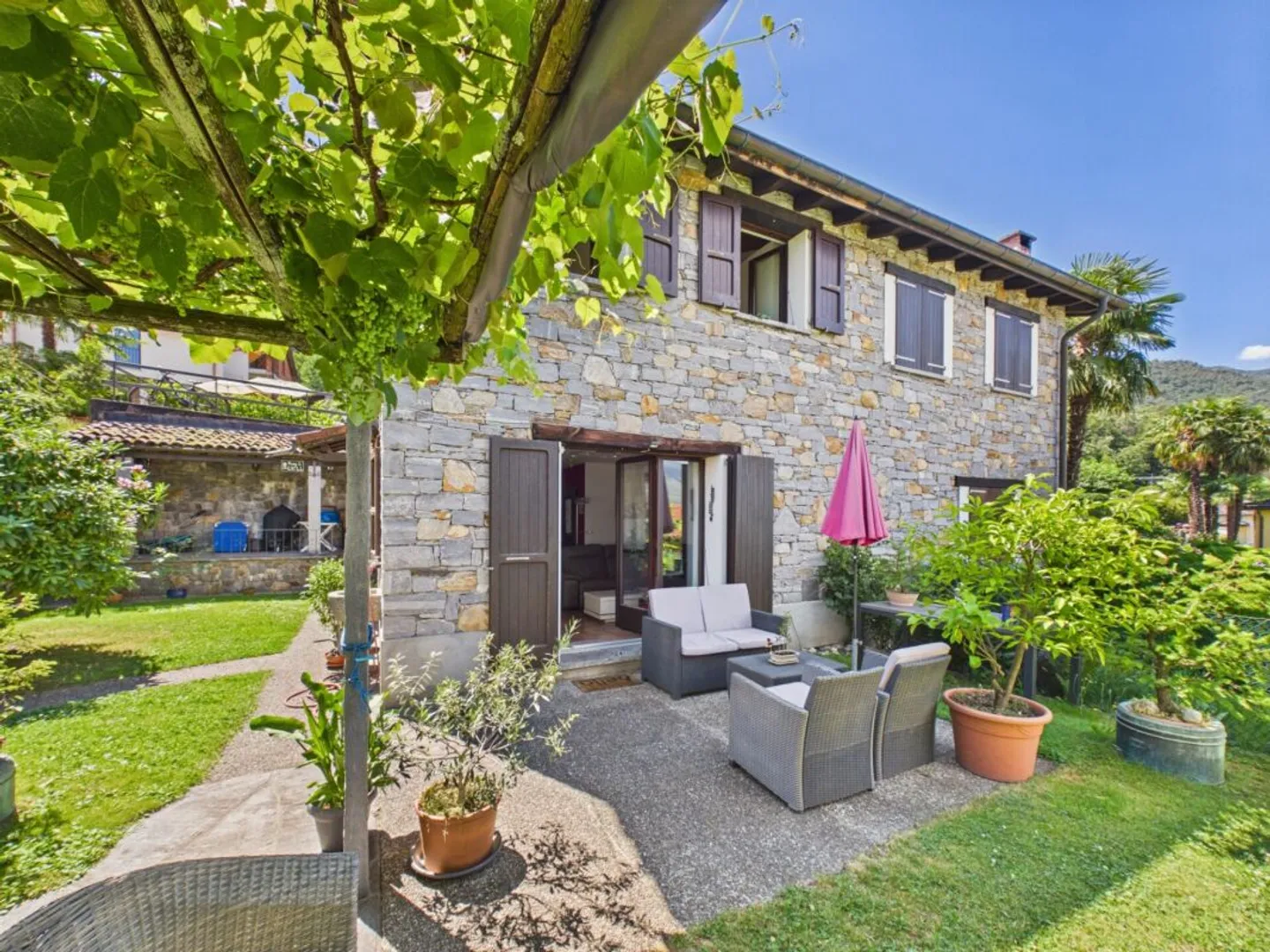 A small Ticinese gem in stone with private garden - Photo 1 of 13
