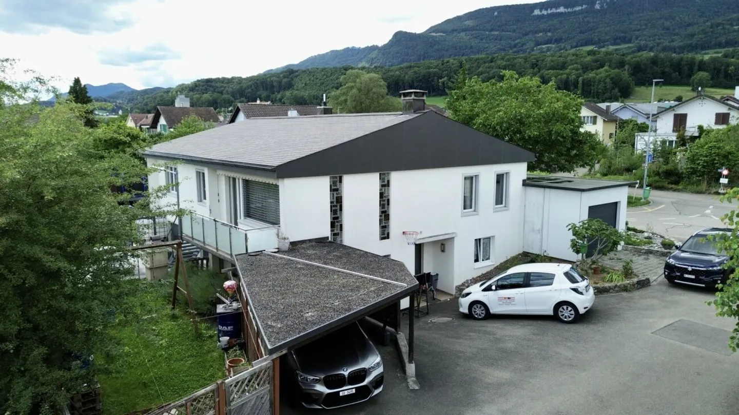 A House, Two Possibilities - Family Paradise with Potential - Photo 2 of 13