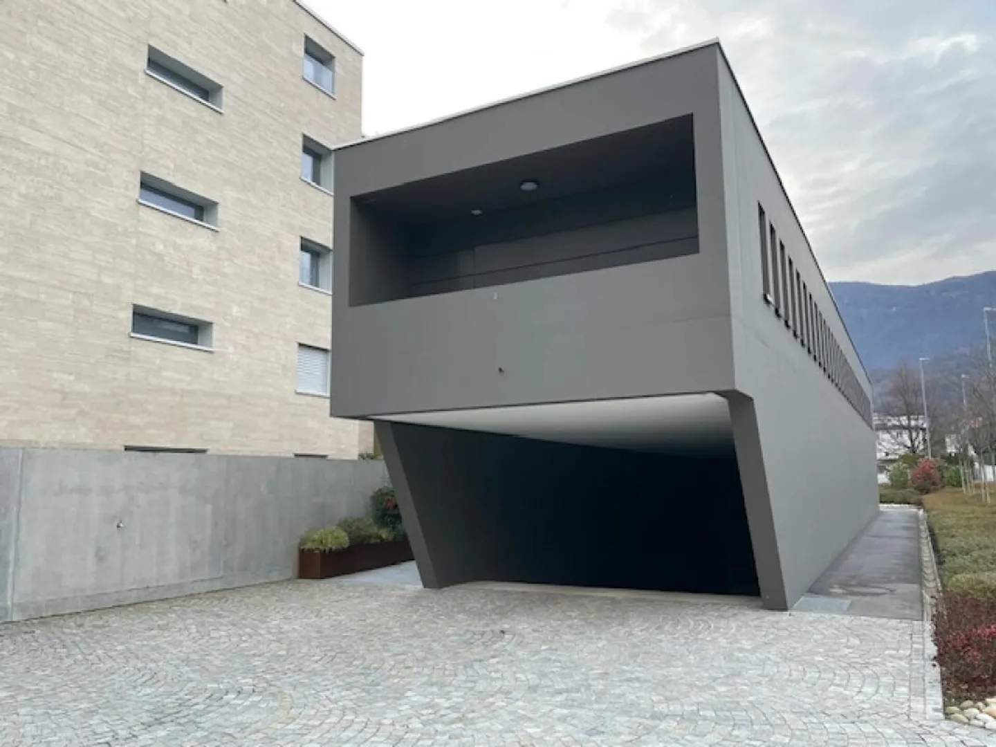 Parking space in the underground garage in Losone - Photo 1 of 4