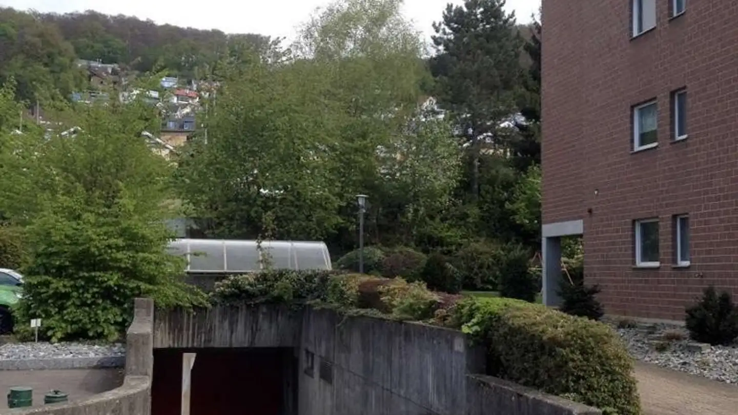 Place de parking souterraine à louer - Lehengasse 35a, 4142 Münchenstein