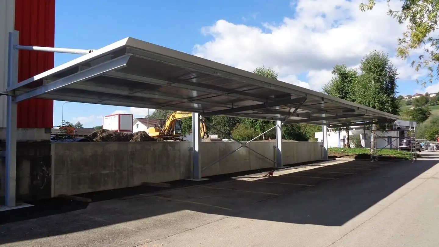 Überdachter Parkplatz mieten - Aux Fossés 1, 2852 Courtételle