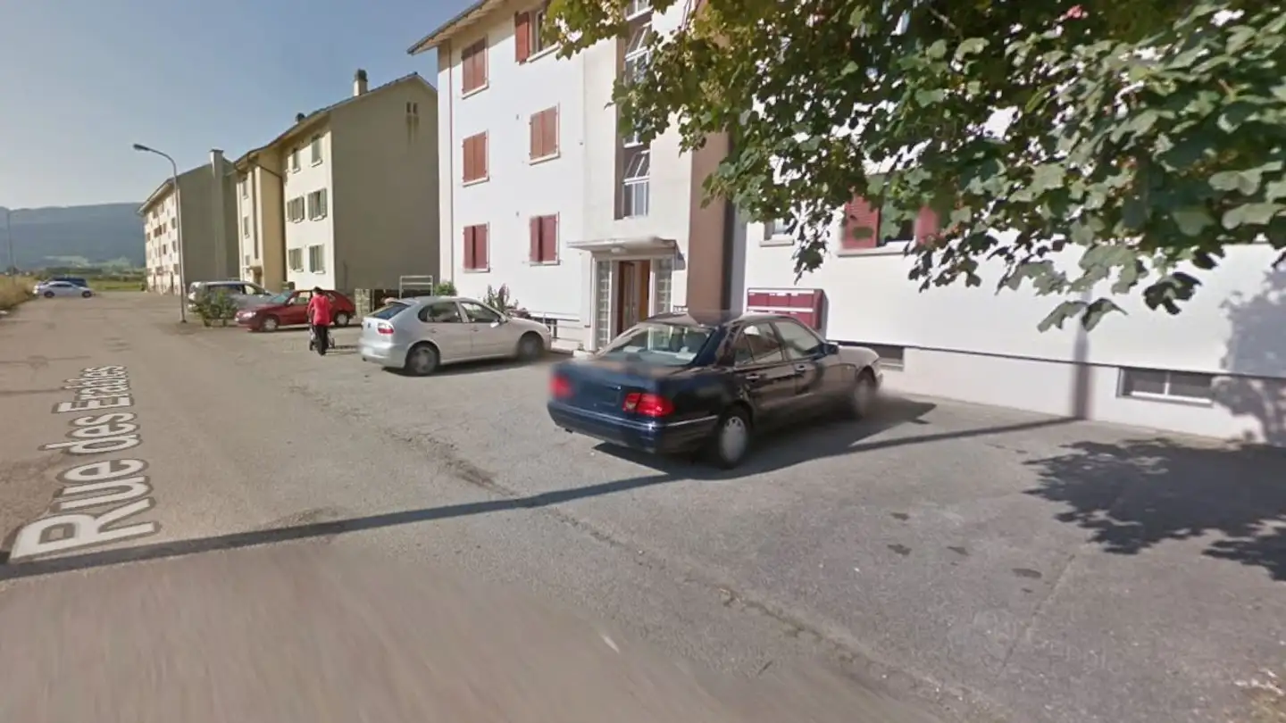 Place de parking extérieure à louer - Rue Des Erables 4, 2800 Delémont