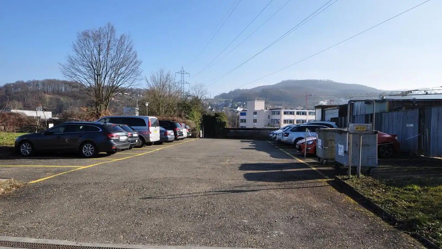 Place de parking extérieure à louer - Pumpwerkstrasse 24, 4142 Münchenstein
